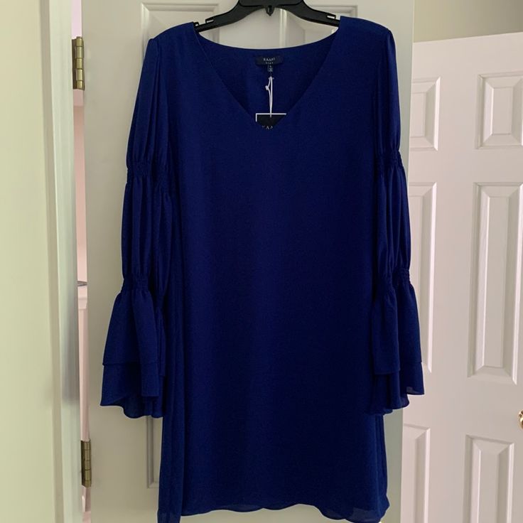 Kaari Blue Dress Blue Flowy Dress For Brunch, Blue Long Sleeve Dressy Dress, Flowy Blue Brunch Dress, Dressy Blue Long Sleeve Dress, Dressy Long Sleeve Blue Dress, Blue Flowy Knee-length Dress, Blue Knee-length Dress For Brunch, Blue Flowy Dress For Date Night, Flowy Blue Dress For Date Night