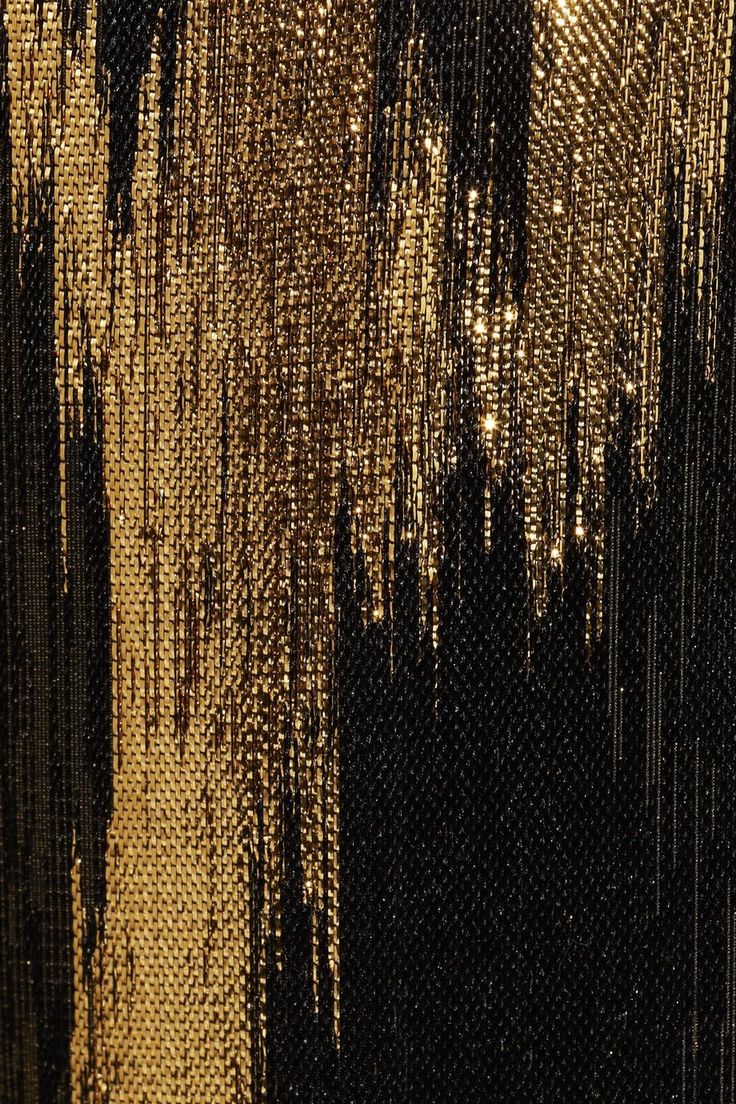 an abstract painting with black and gold colors on it's fabric, including lines