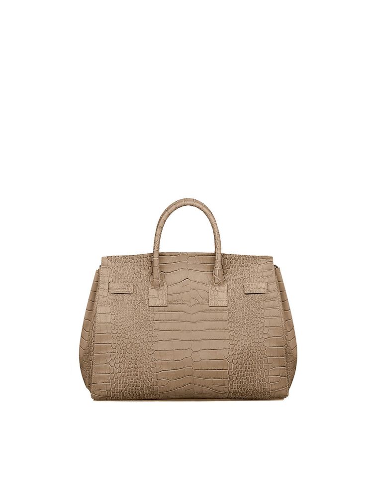 DESIGN
The new Gigi handbag encapsulates Teddy Blake's modern-classic appeal. Made in Italy from croco embossed calf skin the semi structured silhouette is reworked to fit an on-the-go lifestyle. The detachable strap allows it to be styled over the shoulder and the roomy interior can fit all your daily essentials &more.
DESCRIPTION
Made In ItalyCroco embossed leather with white stitchingReal suede interiorGold toned hardware
DETAILS
Media10.6"h x 5.7"w x 13.4"lHandle drop length: 3.4"17" to 23" Luxury Bags With Textured Finish, Luxury Rectangular Satchel With Crocodile Pattern, Luxury Crocodile Pattern Satchel For Everyday Use, Classic Everyday Luxury Bag With Crocodile Pattern, Classic Bags With Crocodile Pattern For Everyday Luxury, Luxury Crocodile Pattern Top Handle Satchel, Luxury Beige Shoulder Bag With Crocodile Pattern, Everyday Luxury Textured Leather Rectangular Bag, Timeless Business Bag With Crocodile Pattern