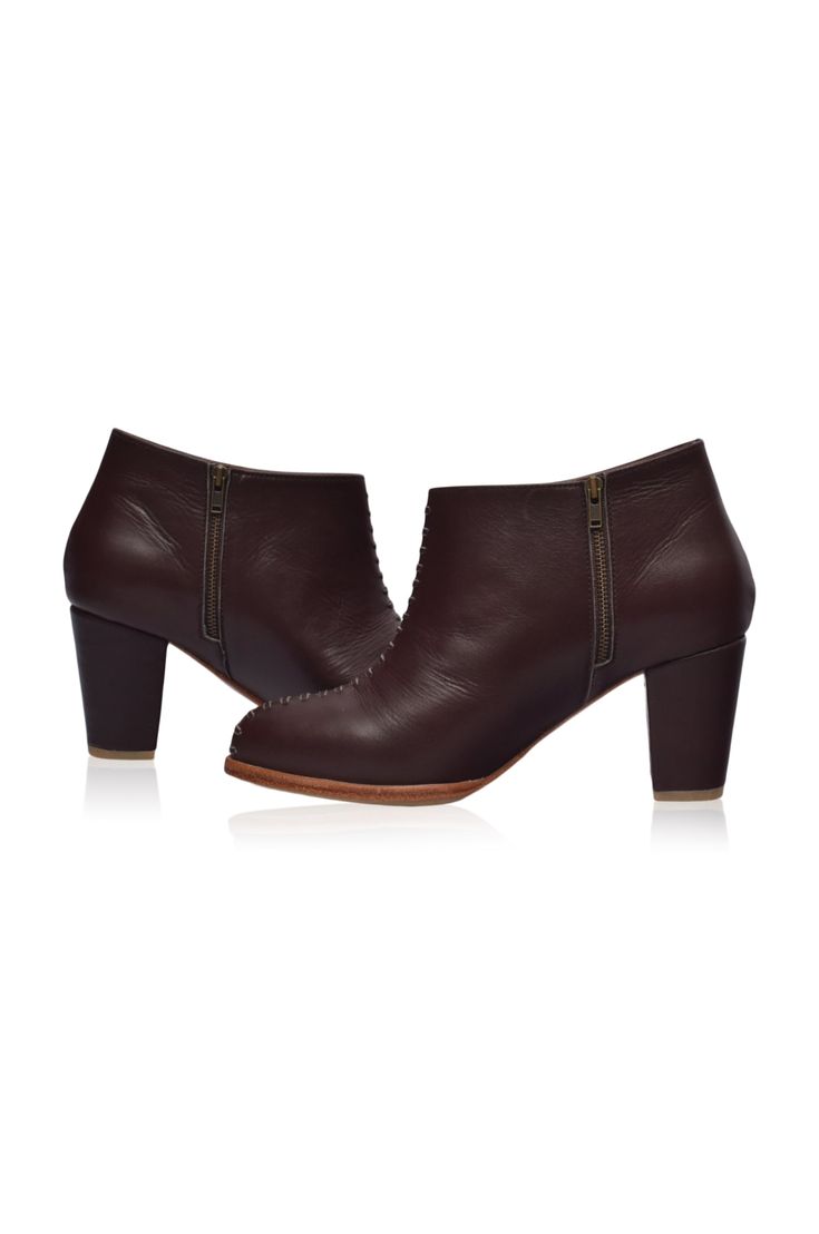 These gorgeous Monte Carlo ankle booties are a must-have in your shoe repertoire. Designed in ankle height silhouette with leather stitch design on the upper and featuring leather-wrapped block heel they are chic, timeless, and comfortable booties that can be worn for any occasion. Style these booties with your maxi or midi dress to elevate your everyday casual style or with your skinny jeans for an urban stylish look. 100% genuine leather Smooth leather lining and insole with embossed logo Ligh Leather Weekender Bag, Wooden Heel, Sleeved Romper, Leather Wraps, Leather Booties, Stitch Design, Embossed Logo, Monte Carlo, Ethical Fashion