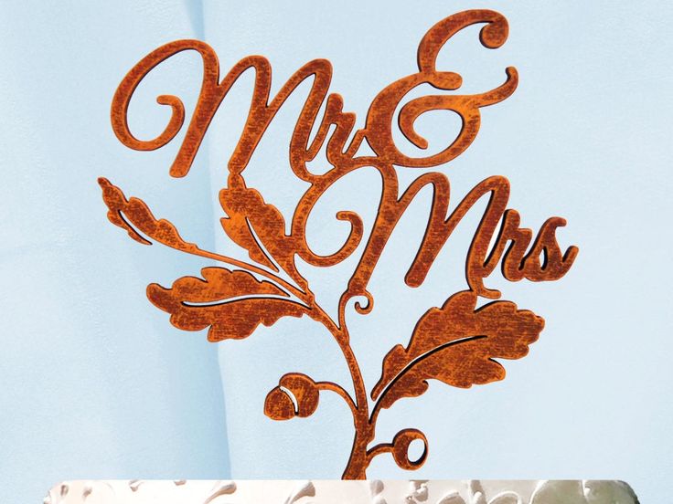 a cake topper that says mr and mrs on it