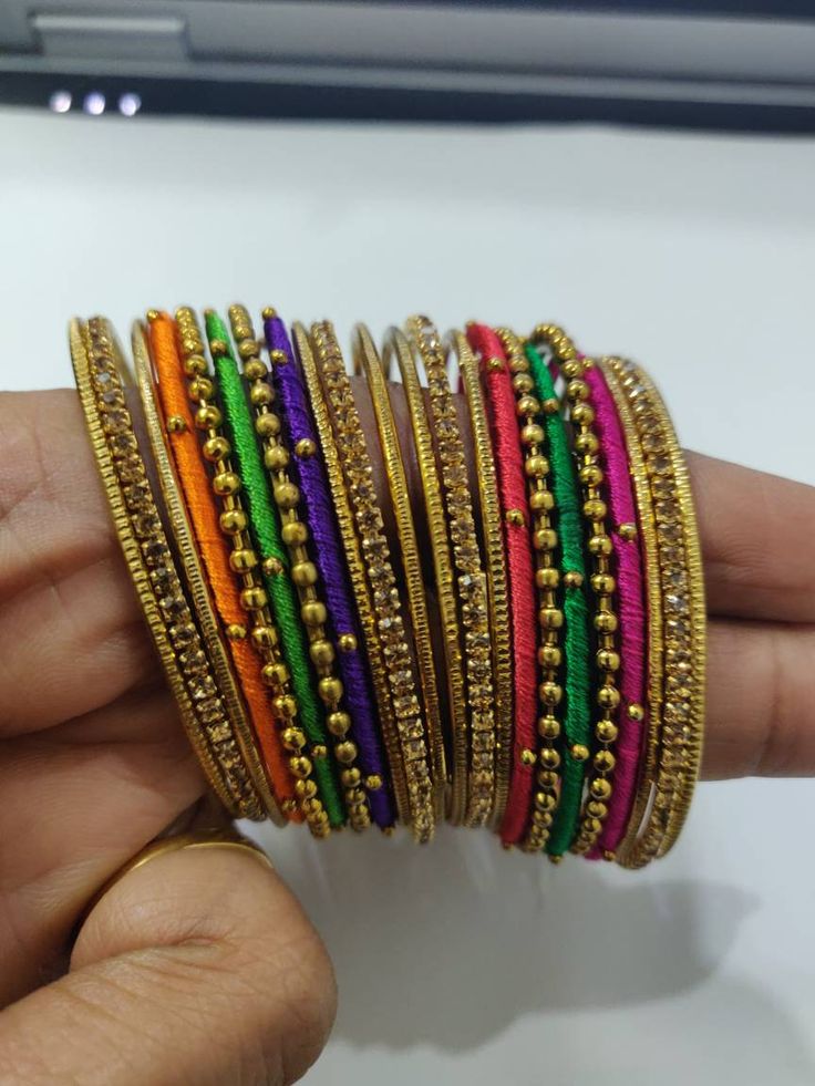 Welcome to our shop We bring to you very ethnic products from core of India almost every thing is handmade or custom made Set of 22 Bangles in multiple colors Size 2.4 We will be happy to serve you Multi Colour Bangle Set, Multi Colour Bangles, Festive Handmade Yellow Bracelets, Multicolor Bangle For Festive Occasions, Traditional Multicolor Bangle With Round Beads, Pink Handmade Bracelet For Diwali, Handmade Pink Bracelets For Diwali, Handmade Pink Bracelet For Diwali, Thread Jewelry For Festivals As A Gift