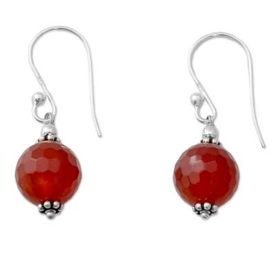 Globes of bright carnelian reveal subtle honeycomb facets. From Narayani, these earrings are handcrafted of sterling silver to showcase the lovely gems. Carnelian Gemstone Dangle Earrings, Amber Carnelian Gemstone Earrings, Silver Carnelian Drop Earrings, Faceted Carnelian Jewelry Gift, Orange Gemstone Sterling Silver Earrings, Silver Carnelian Jewelry With Ear Wire, Silver Carnelian Earrings, Elegant Silver Carnelian Earrings, Carnelian Gemstone Round Earrings