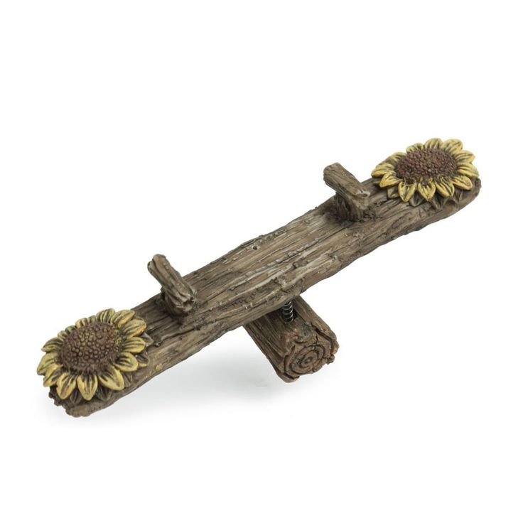 a wooden cross with two sunflowers on it