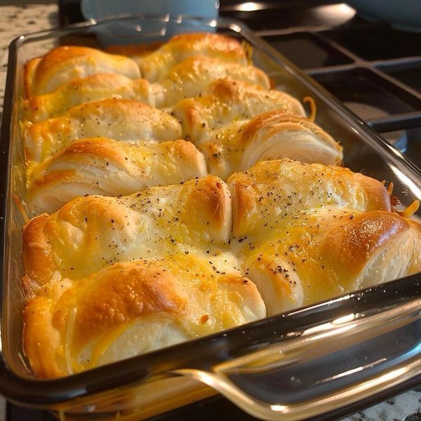 a casserole dish filled with bread and cheese