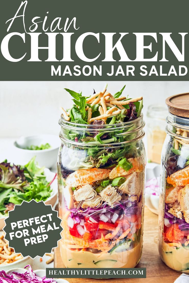 two mason jars filled with salads on top of a wooden table next to other food