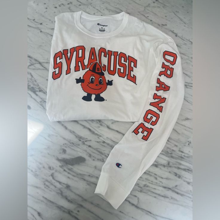 Nwot Syracuse University Long Sleeve Tshirt. Never Worn. In Excellent Condition. The College Mascot, Otto, Is Featured Prominently On The Front. Note “Orange” Runs Down The Left Sleeve. Collegiate White Top For Fall, Collegiate White T-shirt For Fall, White Collegiate T-shirt For Fall, White Tops For School Spirit In Fall, White Tops For Fall School Spirit, White College Style Tops For Fall, College Style White Tops For Fall, White Tops For College In Fall, White Screen Print Shirt For Fall