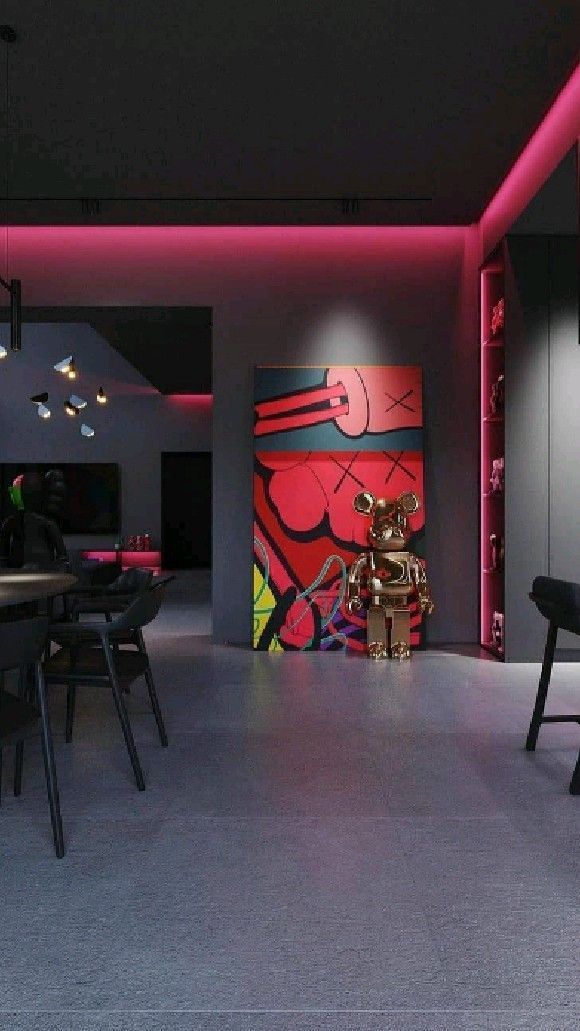 the room is lit up with neon lights and black chairs in front of an abstract painting