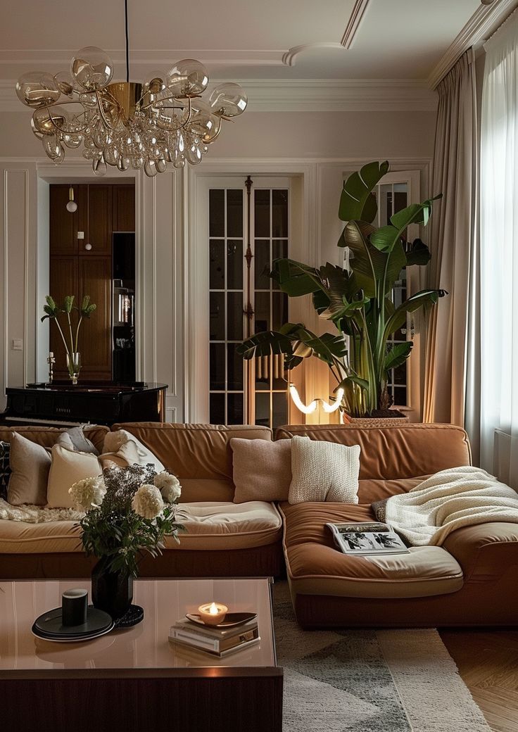 a living room filled with furniture and a chandelier