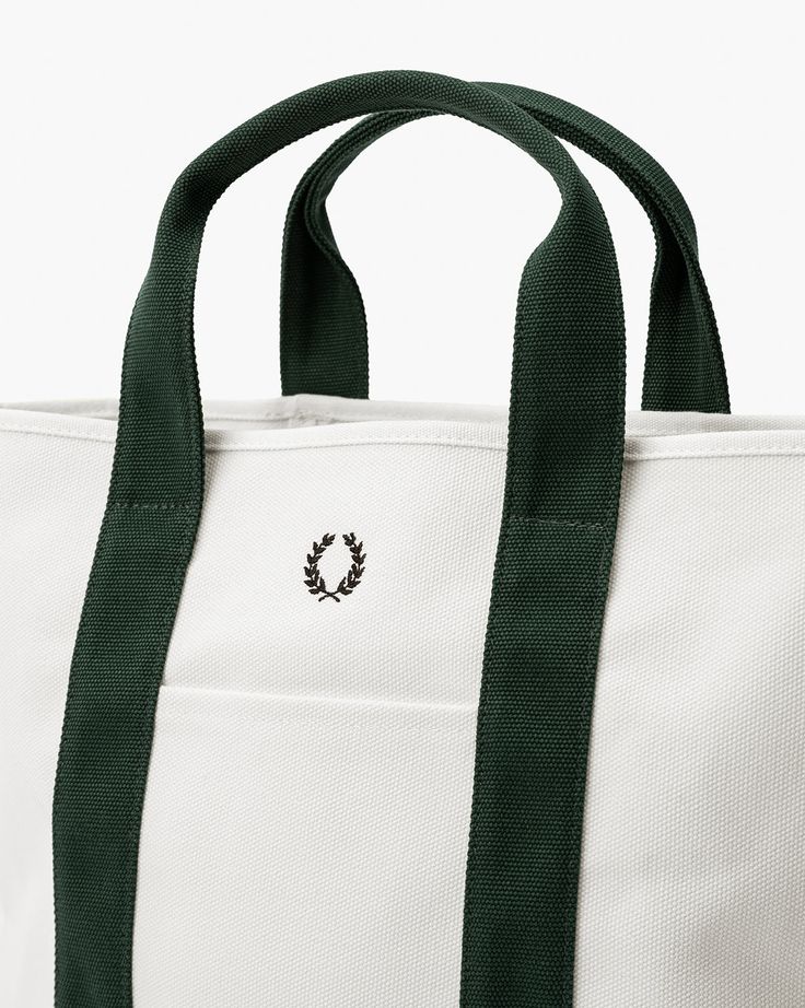 Featuring a custom green colorway on both the handles and base, our Canvas Laurel Tote is a durable everyday tote with an inner pocket. The tote comes in two sizes and features our original Studio McGee logo. Mcgee & Co, Everyday Tote, Studio Mcgee, Handles, Canvas, Green