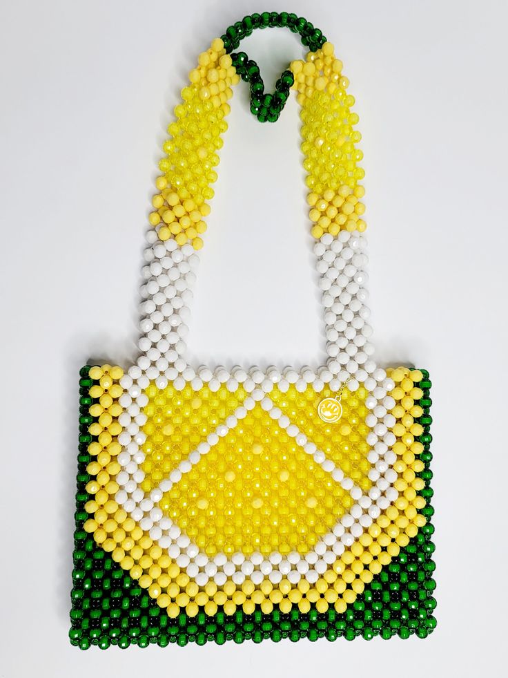 This beaded handbag is a true original! At approx. 9"X 8"X 2" It's the perfect size for your phone, keys and cards.  The 20" strap is great for over the shoulder and nestles high and securely.  Also a wonderful length to carry by handle down by the hip.  Made of acrylic beads, so its super easy to handwash when needed.  Made by Lora Rolling.  Ships to US (only) via USPS.  Arrives within 7 days! All sales are final. Questions? Text 214-872-0062 Daily Use Beaded Crossbody Shoulder Bag, Everyday Beaded Crossbody Shoulder Bag, Everyday Beaded Shoulder Bag, Beaded Tote Shoulder Bag, Beaded Crossbody Bag For Everyday Use, Everyday Beaded Tote Shoulder Bag, Everyday Beaded Crossbody Bag, Everyday Beaded Rectangular Shoulder Bag, Green Beaded Shoulder Bag For Daily Use