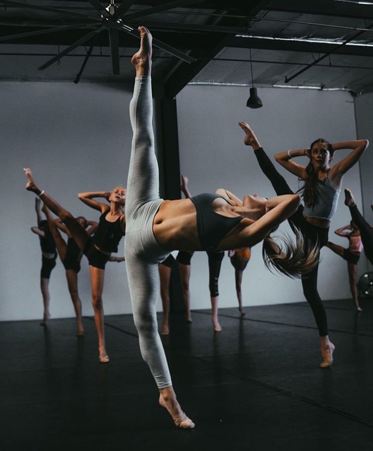 a group of dancers in a dance studio