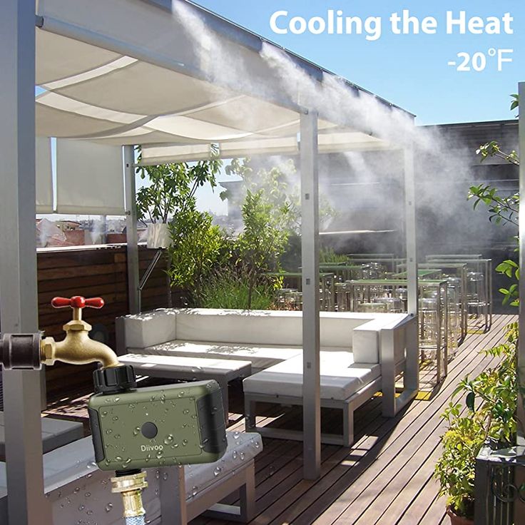 an outdoor hot tub on a deck with steam coming out of the top and surrounding it