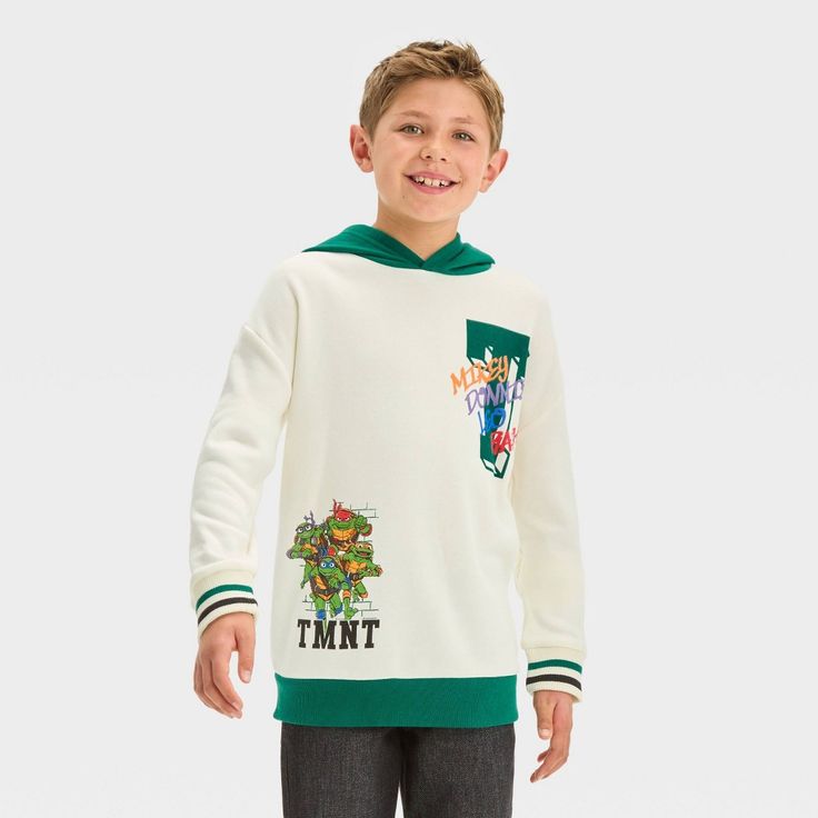 Bring fun style to their cool-weather wardrobe with this Teenage Mutant Ninja Turtles Fleece Pullover Sweatshirt. This hooded sweatshirt is crafted from midweight fleece fabric for all-day cozy comfort, and it's designed with a ribbed hem and cuffs for a neat finish. Designed in a cream hue with a green hood and hem, and green and brown varsity stripes on the sleeves, it features a graphic showing Leonardo, Michelangelo, Donatello and Raphael for a fan-favorite look. Boys Fleece, Kids Clothes Boys, Teenage Boys, Boys Clothes, Fun Style, Hem Style, Mutant Ninja, Hooded Pullover, Teenage Mutant Ninja Turtles