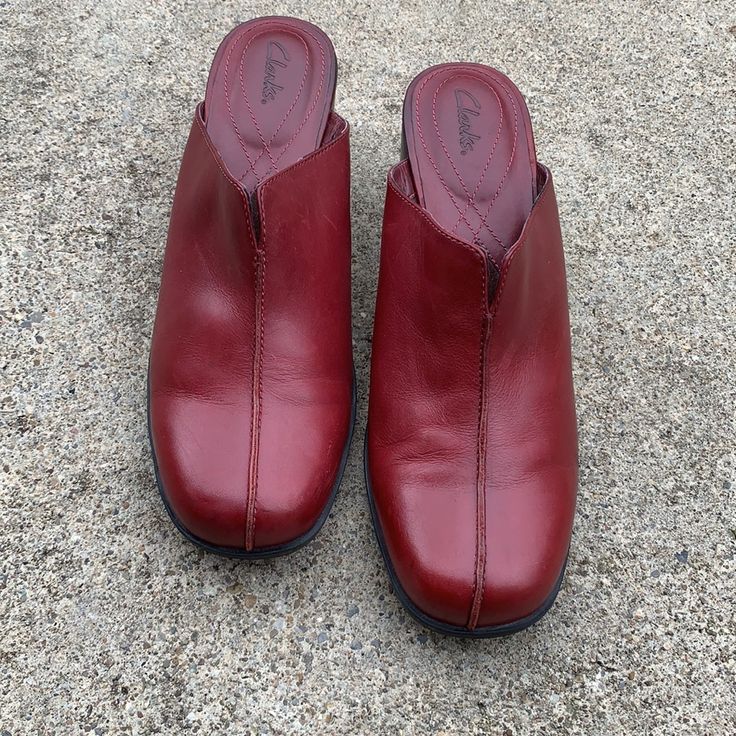 Clarks Dark Red Clogs. From 08/05 Never Worn There Is Some Peeling On Inside Leather Heel Is 2 1/2 Inches Red Slip-on Casual Clogs, Casual Leather Mules With Red Sole, Casual Red Slip-on Clogs, Red Synthetic Clogs With Cushioned Footbed, Red Closed Toe Synthetic Clogs, Casual Clogs With Red Sole And Round Toe, Casual Red Leather Clogs, Red Slip-on Synthetic Clogs, Red Synthetic Comfortable Clogs