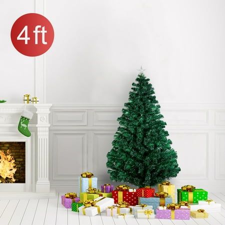 a christmas tree is surrounded by presents in front of a fireplace with the number 4 on it