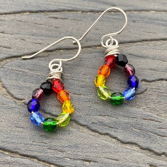 Rainbow dangle drop earrings, made with Czech fire polish glass beads, 4mm rounds, in a rainbow of colors on sterling silver wire.red - orange - yellow - olive green - emerald green - light blue - dark blue - amethyst purple - blackMeasure just under 1 1/2 inches in length, from top of sterling earwire to bottom of earring. Width is 1/2 inch at widest point. ~~~~~~~~~~~~~~~~~~~~~~~~~~~~~Artisan Crafted. All of my items, whether jewelry or decorative works, have been handcrafted by me, one person Colorful Hypoallergenic Dangle Jewelry, Rainbow Nickel-free Drop Earrings, Nickel-free Rainbow Drop Earrings, Rainbow Round Beads Jewelry With Ear Wire, Rainbow Sterling Silver Nickel-free Earrings, Nickel-free Round Rainbow Beaded Earrings, Nickel-free Rainbow Round Bead Jewelry, Nickel-free Rainbow Round Beaded Jewelry, Adjustable Rainbow Sterling Silver Earrings