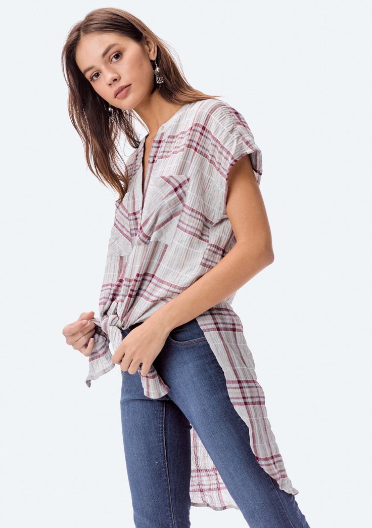 Short sleeve, plaid button-down tunic. Tie it up or wear it long! FINAL SALE Yarn dye plaid Relaxed fit Short cap sleeves Long tunic length Rounded shirttail hemline High side vents Round neckline Button front Double bust pockets 99% Cotton, 1% Spandex Model is 5'9, wearing a size S.Style: I-11596W-PSC-YD Plaid Button-up Tops, Casual Shirttail Hem Tunic For Daywear, Casual Plaid Top With Shirttail Hem, Casual Tunic With Shirttail Hem For Daywear, Fall Button-up Casual Tunic, Short Sleeve Tunic For Daywear In Fall, Short Sleeve Tunic For Fall Daywear, Taupe Grey, Plaid Tunic