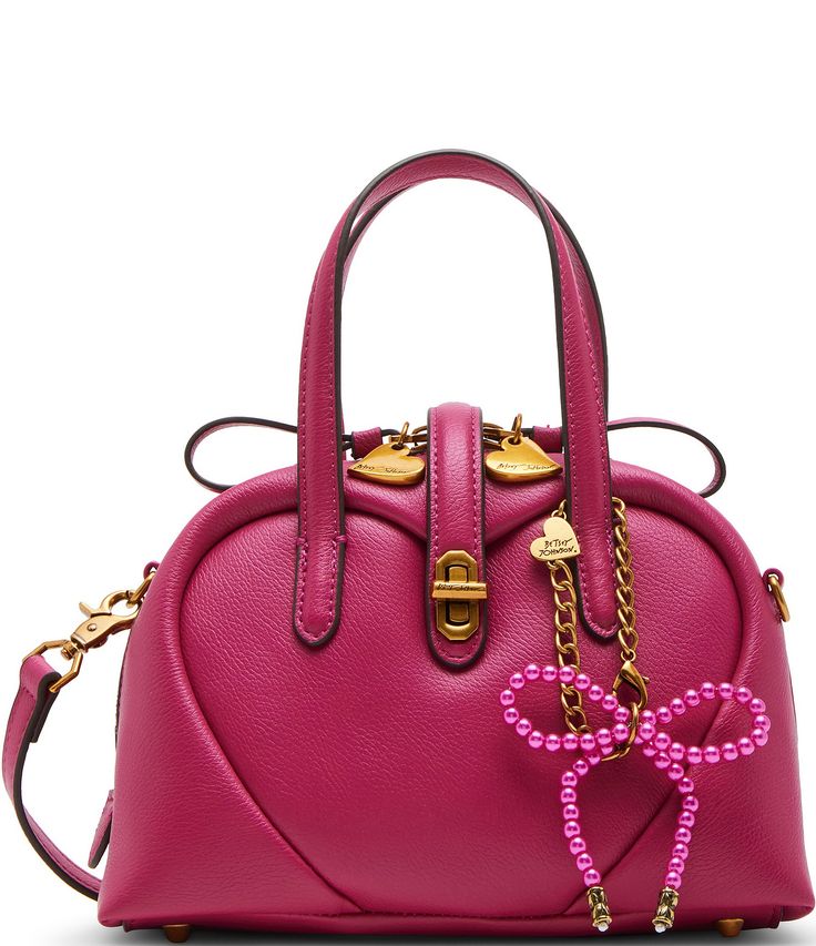 From Betsey Johnson, this handbag features:PU exteriorGold-tone hardwareTurnlock and zipper closureInterior back wall zipper pocket2 interior front wall slip pocketsMetal bow hang-off charmTop handle drop approx. 6",  strap drop 22" Removable crossbody strap Approx. 9" L x 4.25" D x 6" HImported. Betsy Johnson Bags, Heart Pump, Bow Bag, Front Wall, Perfume Gift Sets, Heart Beat, Karl Lagerfeld Paris, Wallet Accessories, Satchel Bag