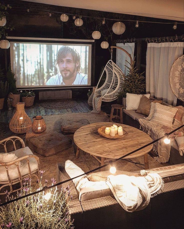 a living room filled with furniture and a flat screen tv mounted to the side of a wall