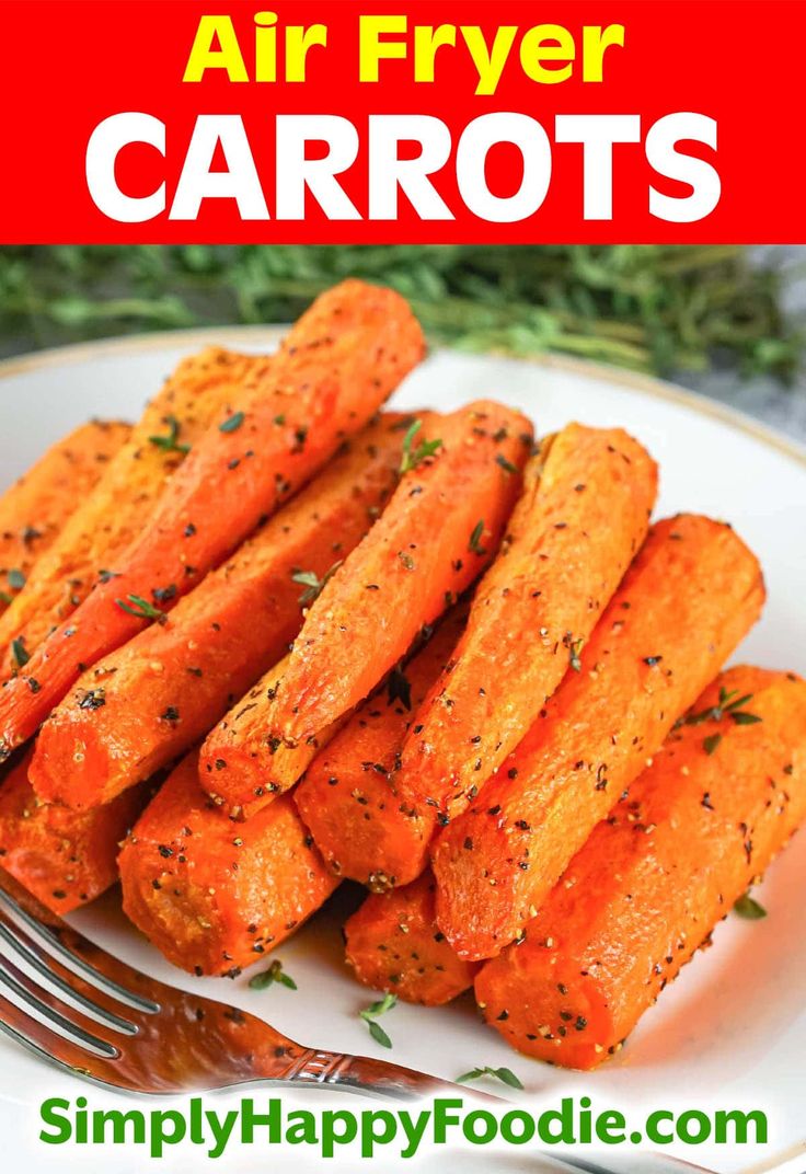 air fryer carrots on a white plate with a fork