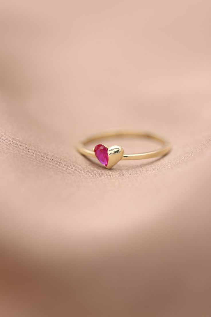 "Handmade Gold Heart With Natural Ruby / 14k 18k Gold Genuine Ruby Ring Available in Gold, Rose Gold and White Gold / July Birthstone ❥ ITEM DETAILS ---> Gold Color of Choice : Yellow Gold, Rose Gold, White Gold ---> Material : 14k ( 585 ) or 18k ( 750 ) Real Gold. It is Not Gold Filled or Gold Plated ---> Made to order ---> Band Thickness : 1.20 mm ---> Band Width : 1.30 mm ---> Ruby Cut: Pear Shape Ruby ---> Number of Stones: 1 Pear Shape Ruby ---> Total Carat : 0.20ct Heart-shaped Jewelry With Bezel Setting For Valentine's Day, Pink 14k Gold Heart Ring Gift, Heart-shaped Bezel Set Jewelry For Valentine's Day, Rose Gold Heart Ring With Birthstone For Gift, Valentine's Day Jewelry With Bezel Setting, Heart-shaped 14k Gold Birthstone Ring, Fine Jewelry With Bezel Setting For Valentine's Day, Heart-shaped Gemstone Rings For Mother's Day, Heart Shaped Gemstone Rings For Mother's Day