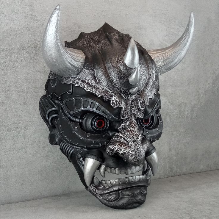 ⭐Name -  Сyber demon mask 💥Application - Wearable mask, can be used as interior decoration 🎨Color - black and silver 🖨️Production - 3D printing 🧵Material -Material - PLA plastic 🖌️Coloring - acrylic paints and varnishes. 🔒 Fastening -  5 adjustable elastic bands that allow you to comfortably hold the mask on your head. ⚙️Features - the mask is equipped with a wall mounting system, which includes 2 plastic hooks for wall mounting and 2 brackets installed on the mask itself. The upper elastic band has a bracket for hanging the mask on a hook or carabiner. A seal is installed in the frontal part of the mask, ensuring comfortable wearing of the mask 📏Internal size: width (at eye level) 155mm height (without horns) 255mm (It is possible to make a mask of a different size) Mask Design - M Black Warrior Masks And Prosthetics For Fantasy Events, Black Samurai Masks For Cosplay, Black Samurai Style Mask For Cosplay, Warrior Style Masquerade Mask For Halloween, Black Samurai Masks And Prosthetics For Cosplay, Black Warrior Style Mask For Cosplay, Samurai Style Black Mask For Masquerade, Black Warrior Style Masks For Masquerade, Black Warrior Mask For Masquerade