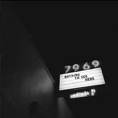 a black and white photo of the marquee sign for 999 nothing is see here