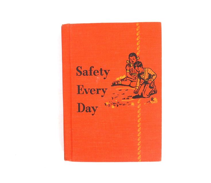 an orange book with the title safety every day