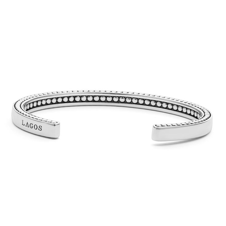 Smooth sterling silver accented by Caviar beading forms this signature cuff bracelet. Sterling Silver Open Cuff Bracelets With Polished Finish, Sterling Silver Open Cuff Bracelet With Polished Finish, Polished Sterling Silver Open Cuff Bracelet, Luxury Silver Open Cuff Bracelets, Modern Sterling Silver Bracelet With Silver Beads, Modern Sterling Silver Stackable Bracelets, Modern Stackable Sterling Silver Bracelets, White Gold Sterling Silver Bangle Beaded Bracelet, Modern Silver Stackable Beaded Bracelets