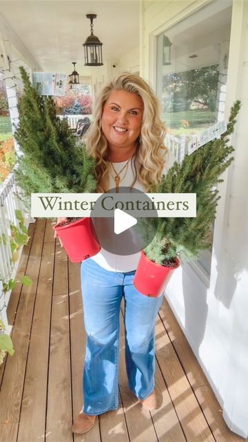 a woman standing on a porch holding two potted plants and the words winter containers