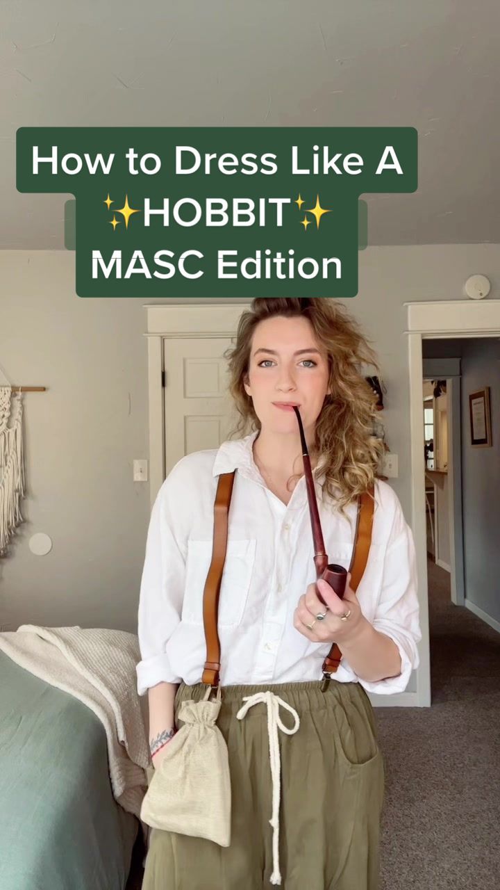 a woman standing in front of a bed with a bag on her shoulder and the words how to dress like a hobbit masc editor