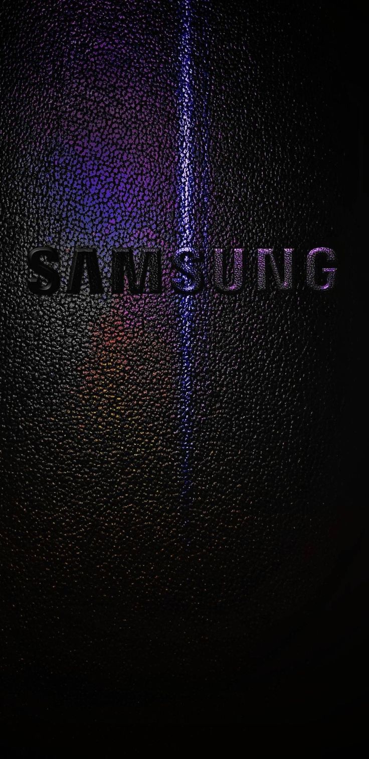 the samsung logo is shown on a black surface with purple and blue lights behind it