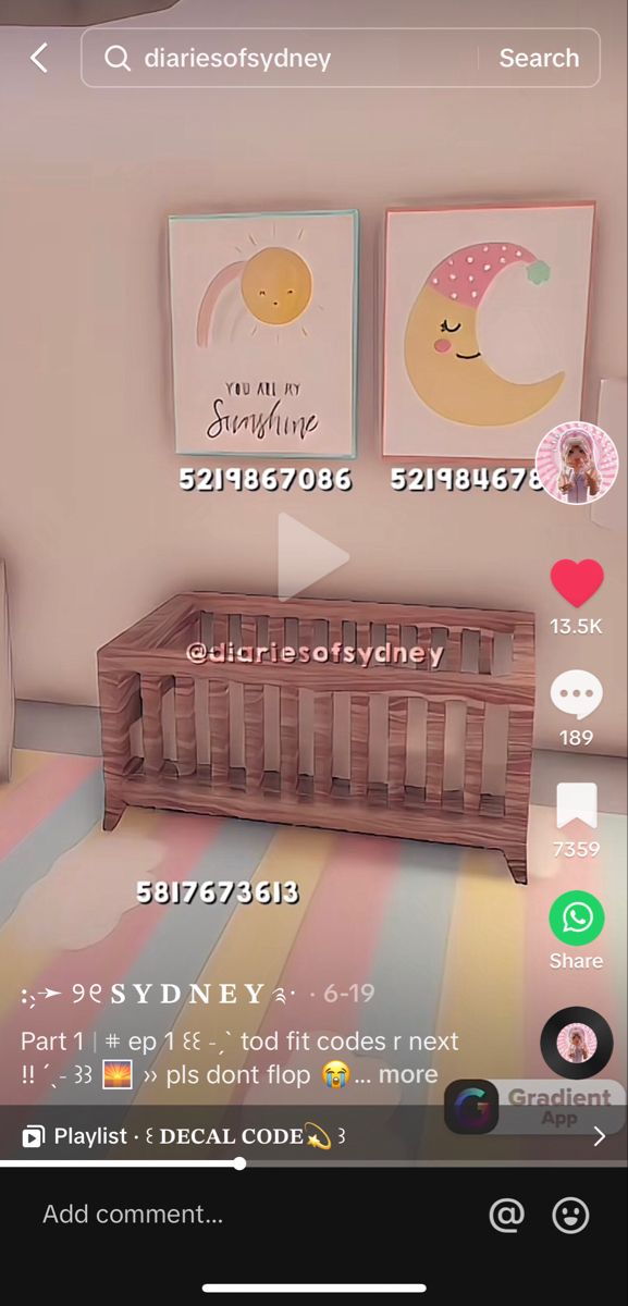 the baby crib is in front of two pictures on the wall and below it's name