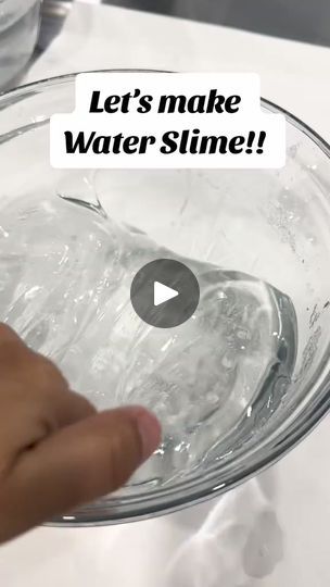 someone is holding a glass bowl with water in it that says let's make water slime