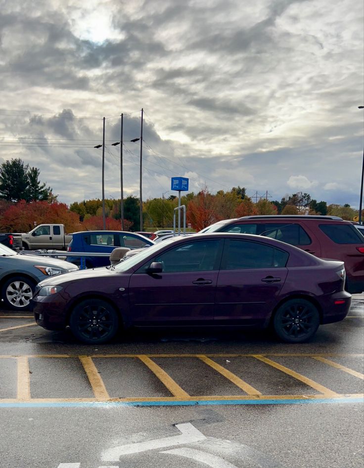 a purple car parked in a parking lot