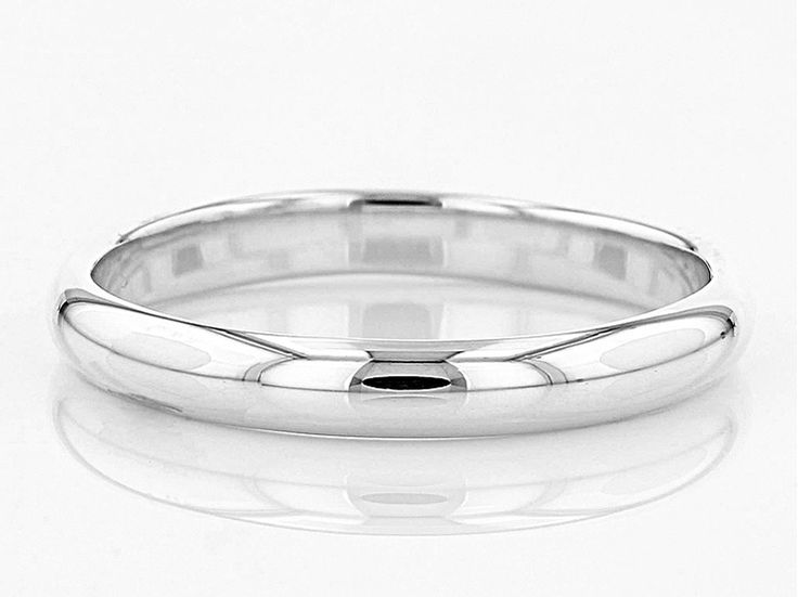 Rhodium over sterling silver band ring. Measures approximately 1/8'L x 1/8'W. Not Sizeable. Sterling Silver Rings With Polished Finish, Sterling Silver Rounded Jewelry With Polished Finish, Classic Rings With Shiny Round Band, Classic Rings With Shiny Finish And Round Band, Modern Jewelry With Polished Round Band, Formal Stackable Platinum Rings, Adjustable White Gold Rings With Polished Finish, Formal Stackable Platinum Rings With Round Band, Formal Platinum Stackable Rings With Round Band