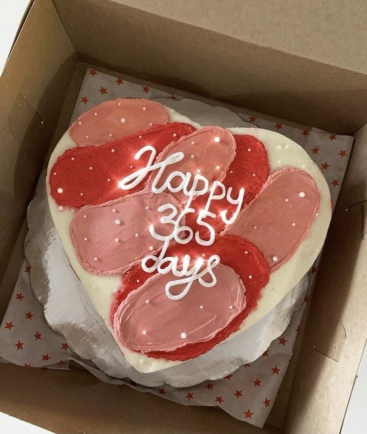 a heart shaped cake in a box with the words happy 35th birthday written on it