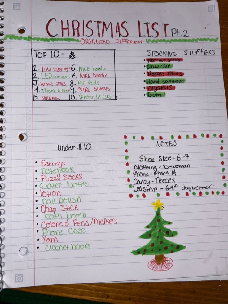 a christmas list is shown on top of a notebook