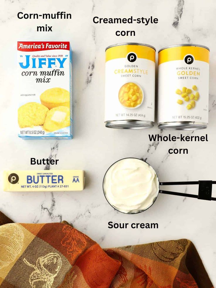 ingredients to make peanut butter cookies laid out on a marble counter top with text overlay