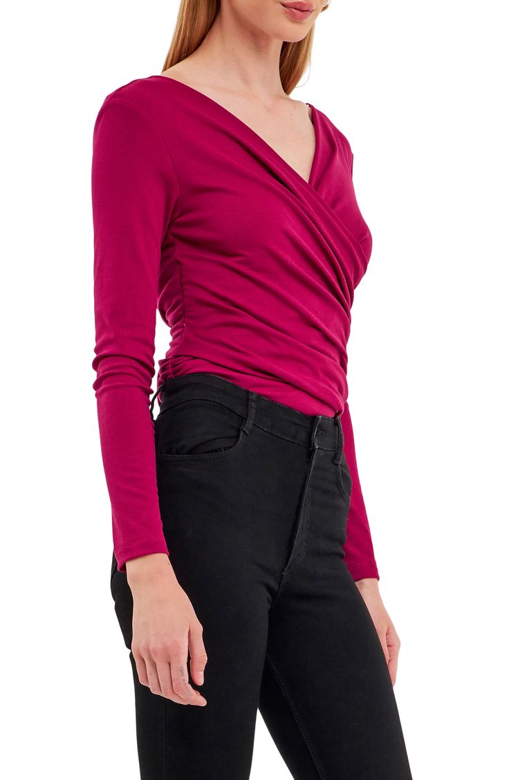 Move stylishly from the office to date night in this shapely shirred top styled with wrapped front-and-back detailing. 65% polyester, 30% rayon, 5% spandex Hand wash, line dry Imported Versatile Wrap Top For Party, Versatile Fitted Ruched Blouse, Ruched Fitted Blouse, Ruched Fitted Elastane Top, Elastane Ruched Tops For Night Out, Fitted Faux Wrap Top With Surplice Neckline, Fitted Wrap Top With Surplice Neckline, Fitted Wrap Top With Faux Wrap And Surplice Neckline, Long Sleeve Twist Front Top For Night Out