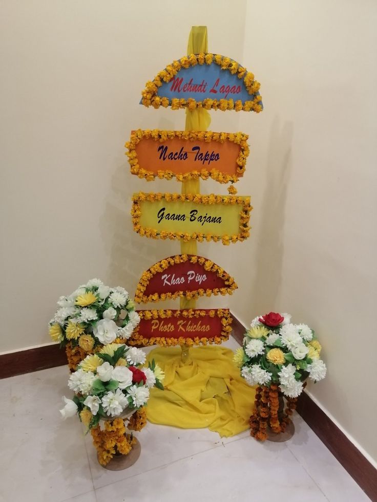 flowers are placed in front of a sign that says welcome to india and vietnam on it