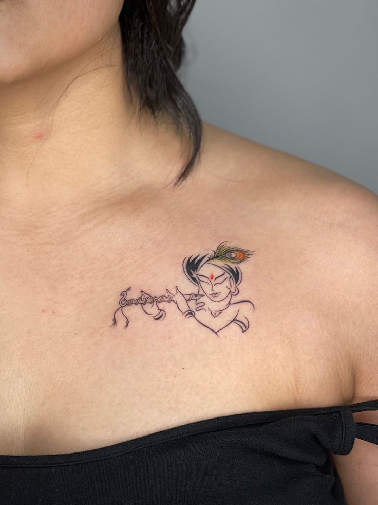 a woman with a tattoo on her chest