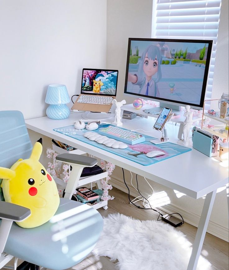 a white desk with a computer monitor, keyboard and pokemon pikachu plush toy