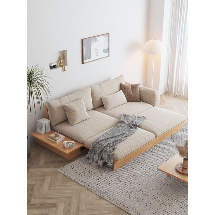 a living room filled with furniture and a cat sitting on top of the couch in front of it