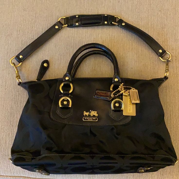 Black Bag In Practically Brand New Condition Designer Black Satchel With Detachable Handle, Designer Black Bag With Handles, Designer Black Bags With Handles, Designer Black Satchel For Travel, Designer Black Satchel With Double Handle, Black Bags With Branded Hardware For On-the-go, Black Travel Bags With Branded Hardware, Designer Black Satchel Tote, Black Satchel With Branded Hardware For Travel