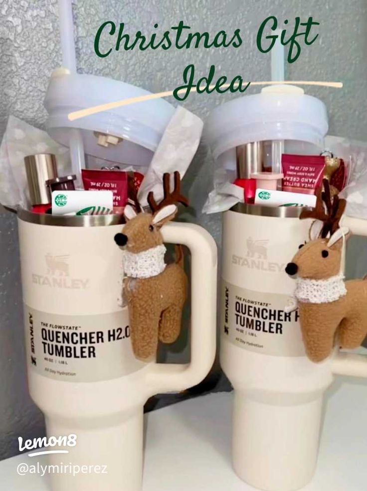 two coffee mugs with reindeer heads in them and the words, christmas gift idea