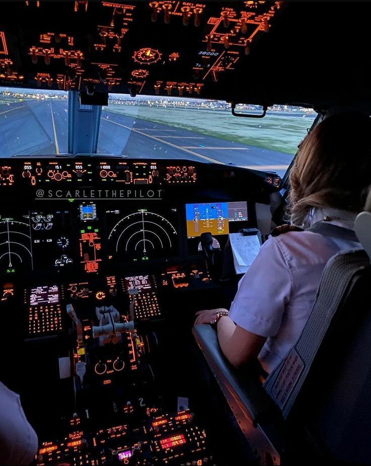 two pilots are in the cockpit of an airplane with their screens showing flight directions and other information