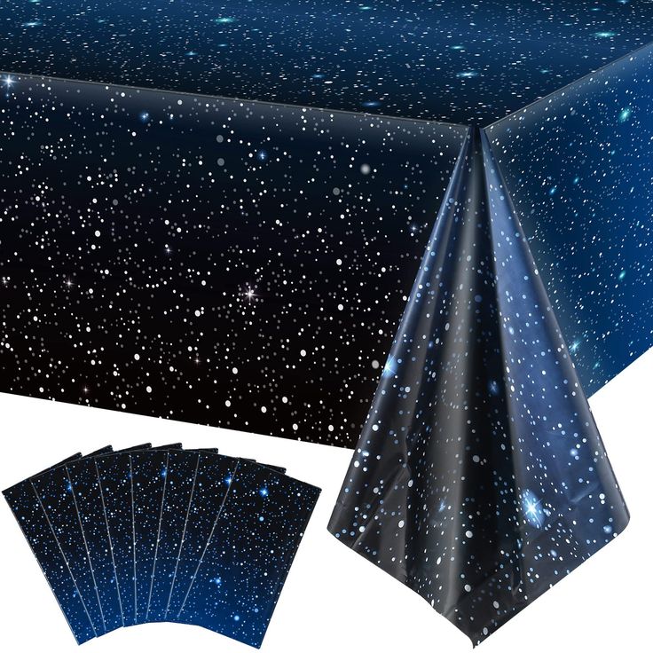 a table cloth with blue stars on it and placemats for the centerpiece