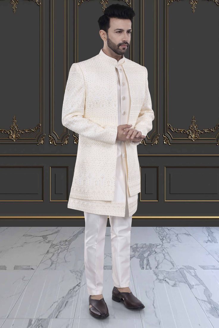 Indulge in luxury and sophistication with our Mens Sherwani- U2-S382. This open jacket sherwani is perfect for special occasions, showcasing your refined and elegant taste. Elevate your style and make a statement with this premium piece. Elegant Unstitched Suit For Reception, Elegant Unstitched Suit For Reception In Transitional Season, Elegant Traditional Wear With Dabka For Reception, Elegant Semi-formal Sets For Eid, Elegant Unstitched Suit With Traditional Drape For Reception, Elegant Front Open Sets With Dabka Work, Elegant Front Open Kurta For Festive Occasion, Elegant Festive Outerwear With Dabka Work, Elegant Cream Bandhgala With Chikankari Embroidery